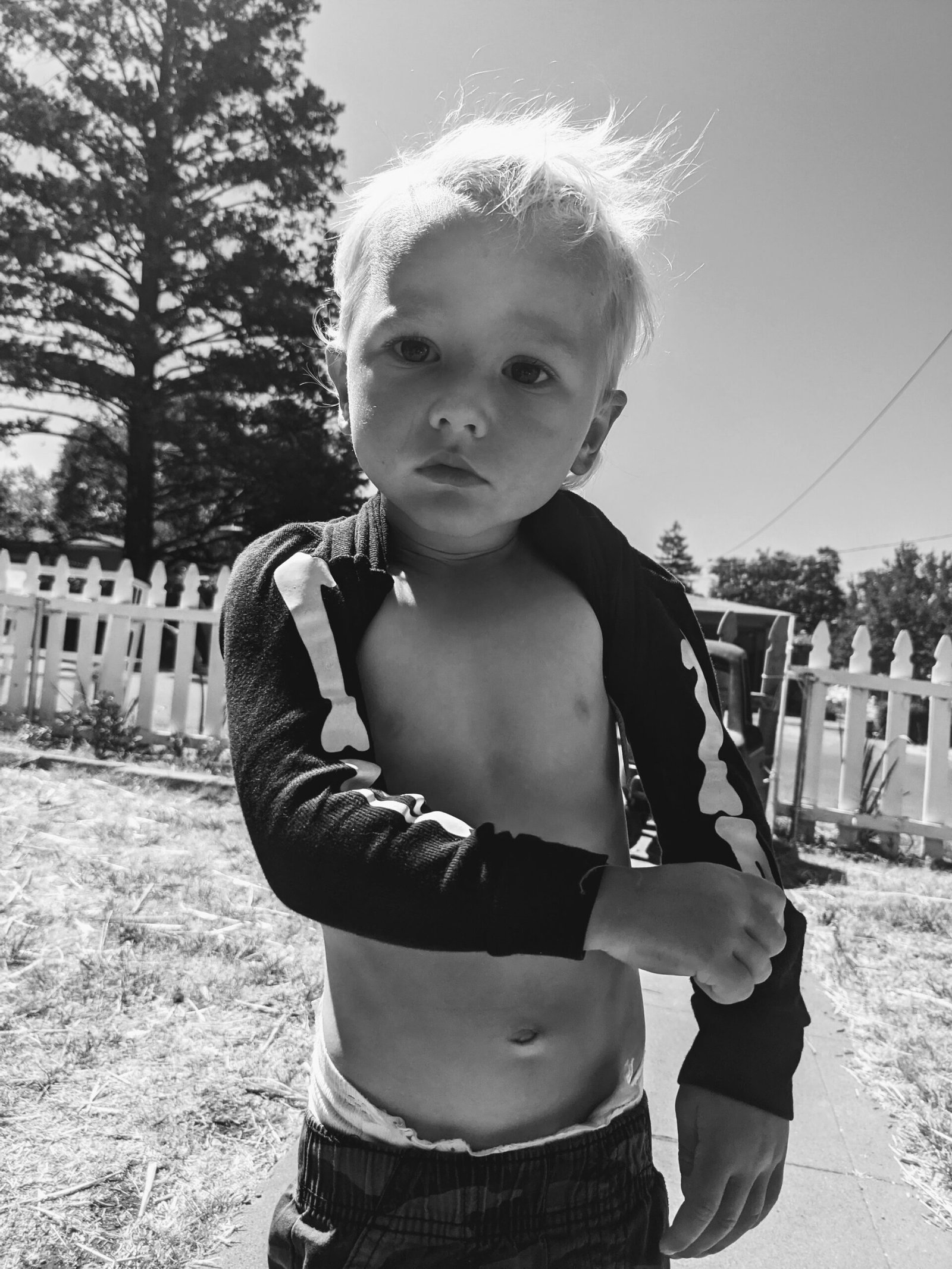 A child getting dressed outside